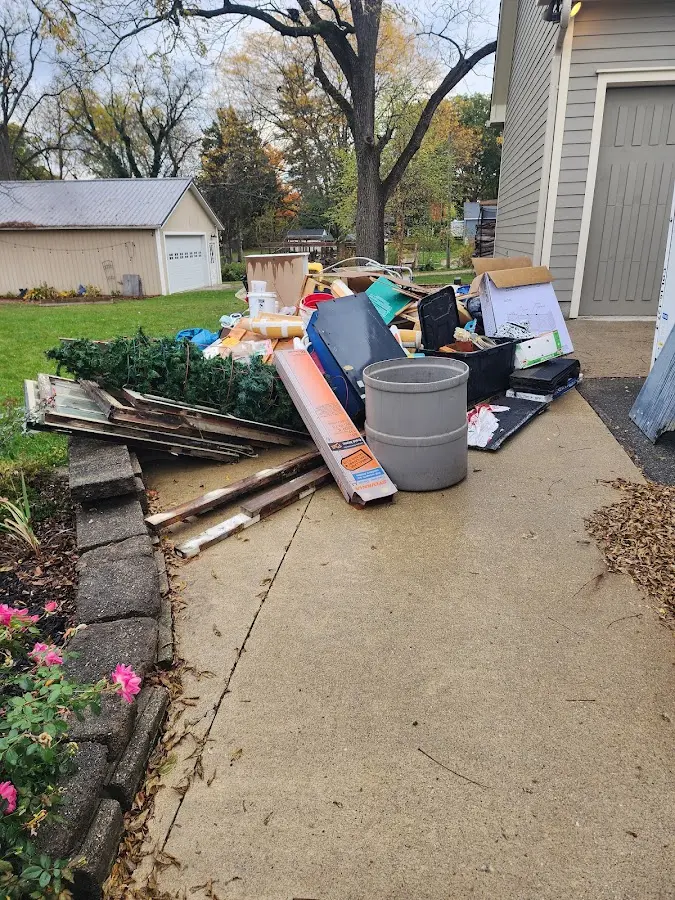 Dumpster being loaded with debris for 3 Yard Dumpster Rental in Rosemont